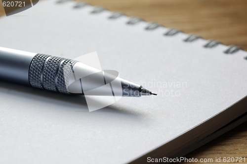 Image of Close up of a pen on a note pad
