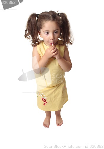 Image of Girl sucking on a lollipop candy