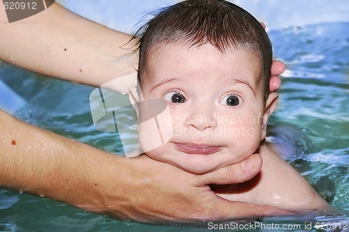 Image of baby bathing, soft focus