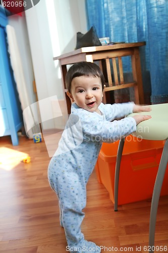 Image of merry boy in interior, soft focus