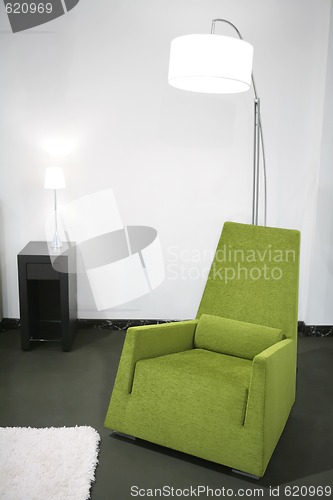 Image of interior with green easy-chair