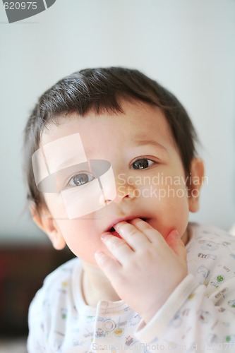 Image of small boy waits its the first teeth