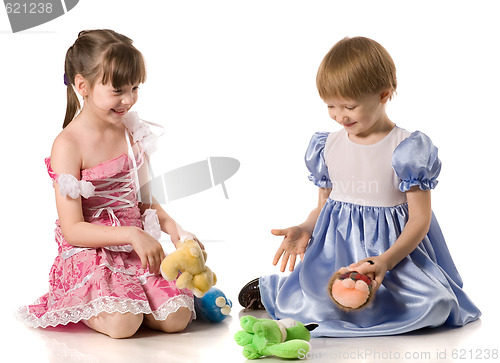 Image of Two girls playing with toys on the floor