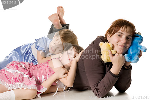 Image of Two little girls sleeping on mum