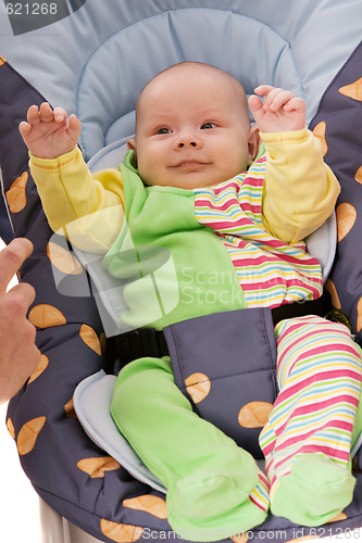 Image of baby in car child armchair