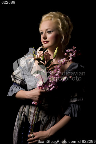 Image of Lovely woman with flowers