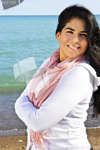 Image of Beautiful young woman at beach