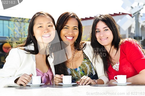 Image of Group of girlfriends having coffee
