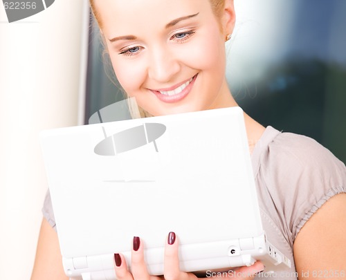 Image of happy businesswoman with laptop computer