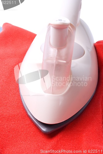 Image of iron on red shirt