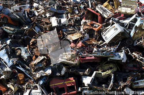 Image of old rusting cars in a junk yard