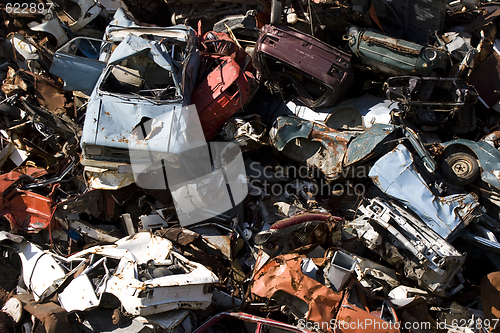 Image of old rusting cars in a junk yard