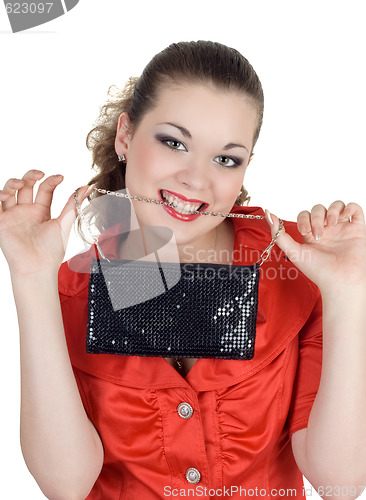 Image of Young woman with a handbag in a teeth