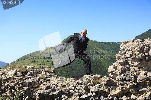 Image of Businessman running