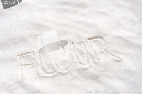 Image of Word "flour" handwritten in flour