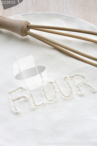 Image of Word "flour" handwritten in flour