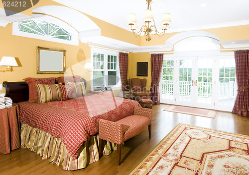 Image of large master bedroom with window light