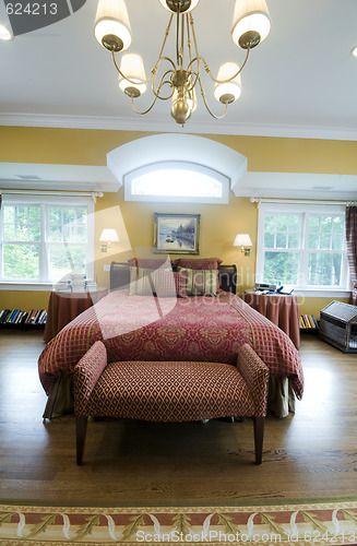 Image of large master bedroom with window light