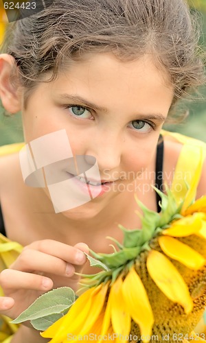 Image of Beauty teen girl and sunflower