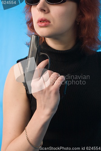 Image of woman with pistol