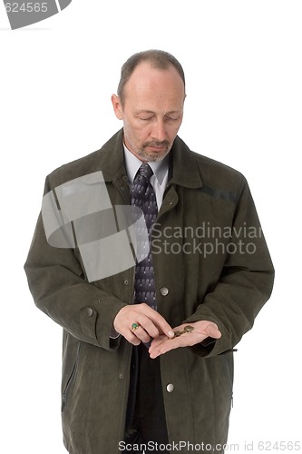 Image of serious man counting coins