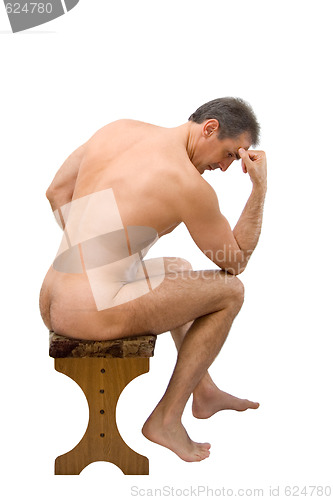 Image of The man sits on a chair