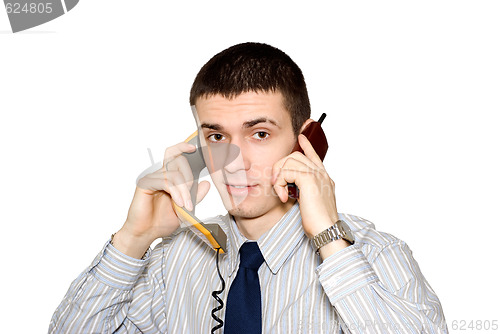 Image of The young man speaks by phone