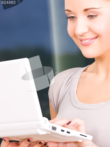 Image of happy businesswoman with laptop computer