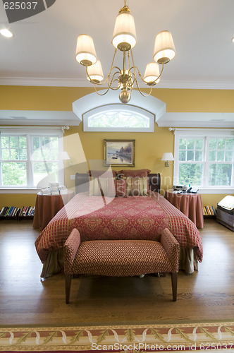 Image of large master bedroom with window light