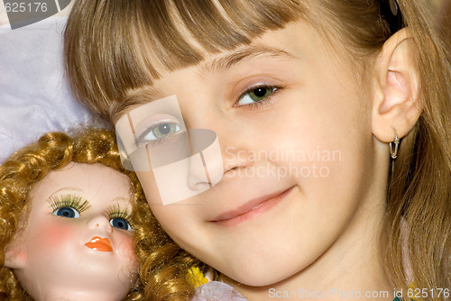 Image of The girl with a doll