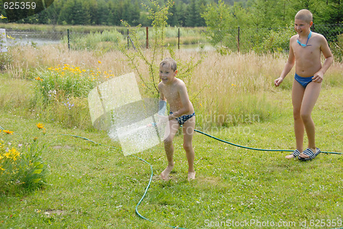 Image of boys play on the grass