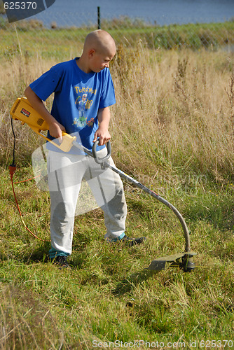 Image of mowing lawn