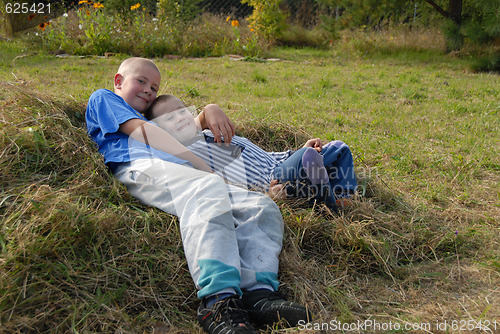 Image of two boys on grass