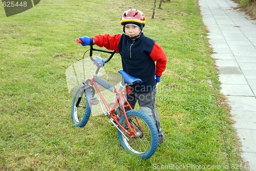 Image of boy and bicycle