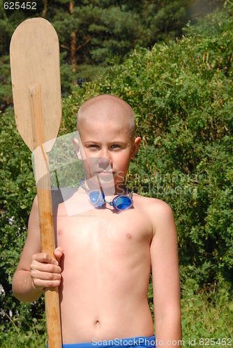 Image of boy and paddle