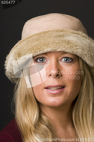 Image of sexy blond woman with fashion hat