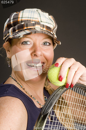 Image of woman practicing tennis stroke