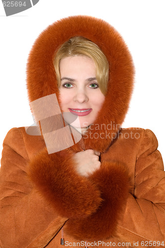 Image of The young woman in a red sheepskin coat