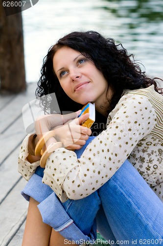 Image of beautiful woman with a book 