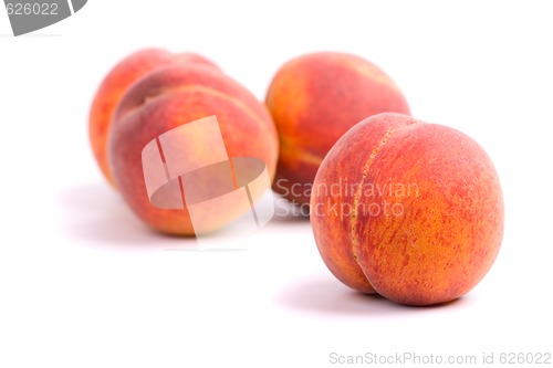 Image of four peaches