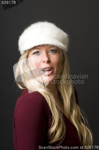 Image of sexy blond woman with fashion hat