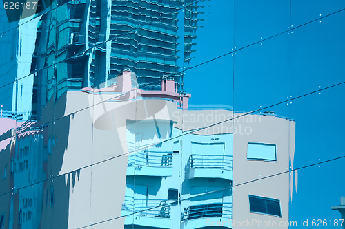 Image of Reflection of a building in glass wall of an office building