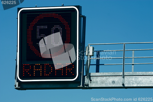 Image of Traffic lights -  in front of blue sky