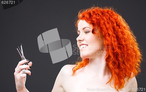 Image of redhead with scissors