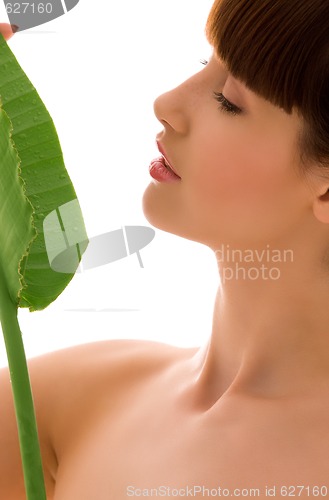 Image of woman with green leaf