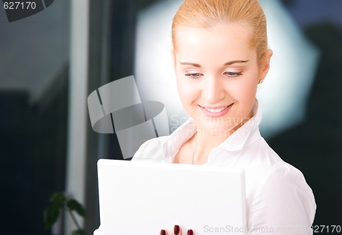Image of happy businesswoman with laptop computer