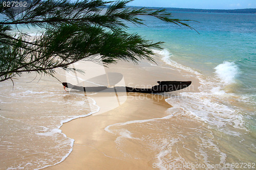 Image of Old ruined fishing boat at sandy bank