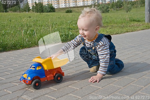 Image of Child with a toy truck