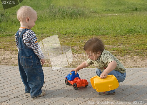 Image of Children with a toy truck