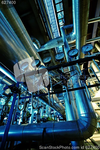 Image of Equipment, cables and piping as found inside of a industrial pow